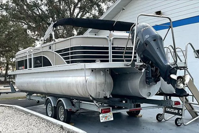 Slide: The Image of 2014 Bennington 2375 GCW pontoon boat on trailer, parked outdoors. - 3