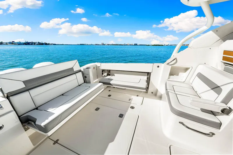 Slide: The Image of 2021 Pursuit DC 365 Dual Console boat interior with ocean view. - 24