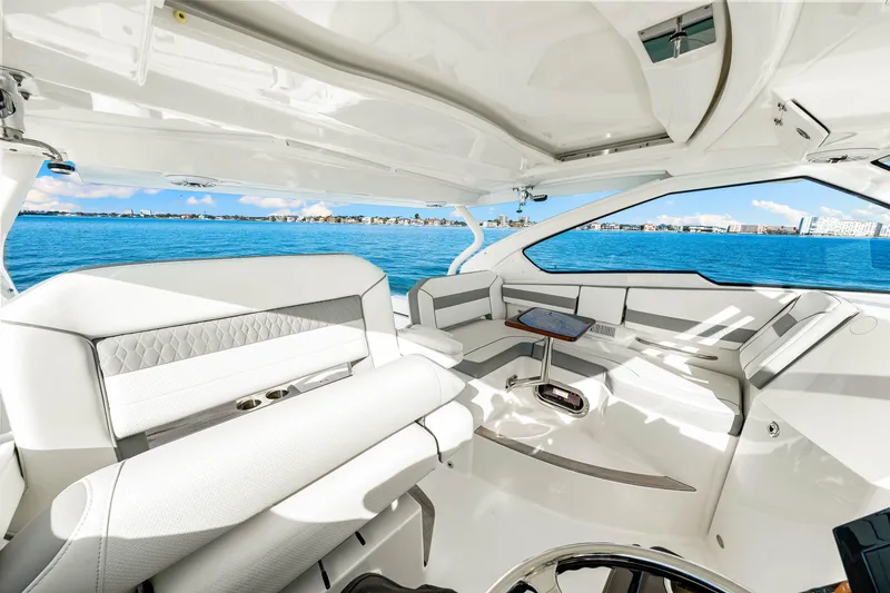 Slide: The Image of Luxurious interior of 2021 Pursuit DC 365 Dual Console boat on open water. - 39
