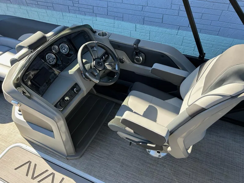 Slide: The Image of 2025 Avalon 2385 LSZ VRL boat interior with steering wheel and captain's chair. - 6