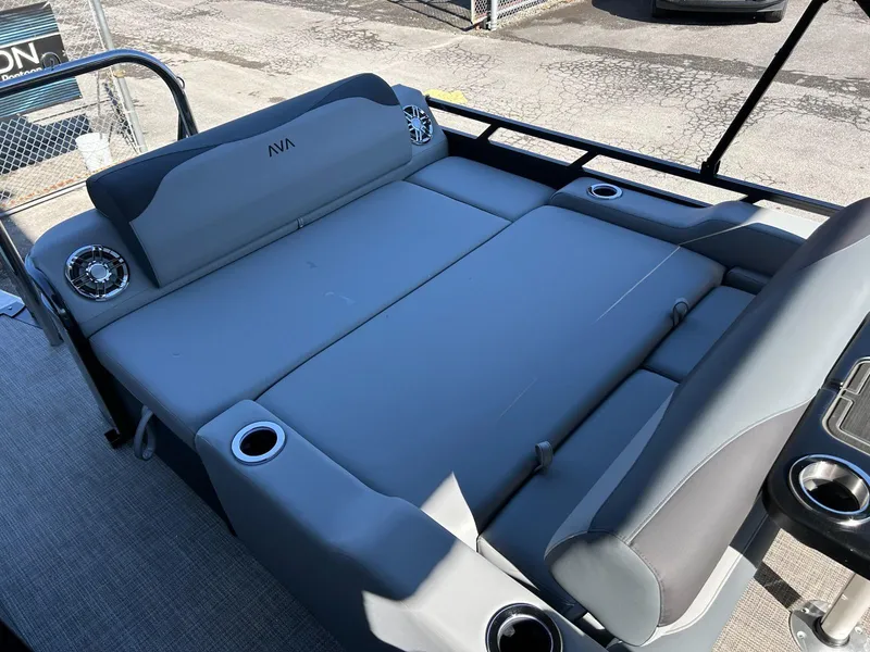 Slide: The Image of 2025 Avalon 2385 LSZ VRL boat interior with gray seating and cup holders. - 9
