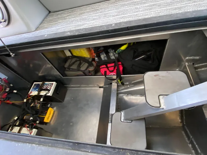 Slide: The Image of Storage compartment of 2022 Montara 25 SURF BOSS 2.0 with equipment and gear. - 14