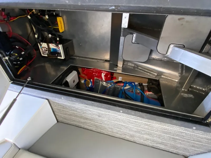 Slide: The Image of Interior view of 2022 Montara 25 SURF BOSS 2.0 boat storage compartment. - 15