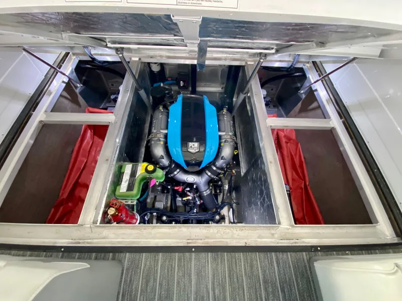Slide: The Image of Engine compartment of 2022 Montara 25 SURF BOSS 2.0 boat, featuring PCM engine. - 19