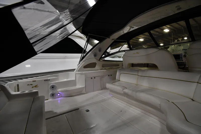 Slide: The Image of 2000 Sea Ray 460 Sundancer interior with white seating and modern design. - 10