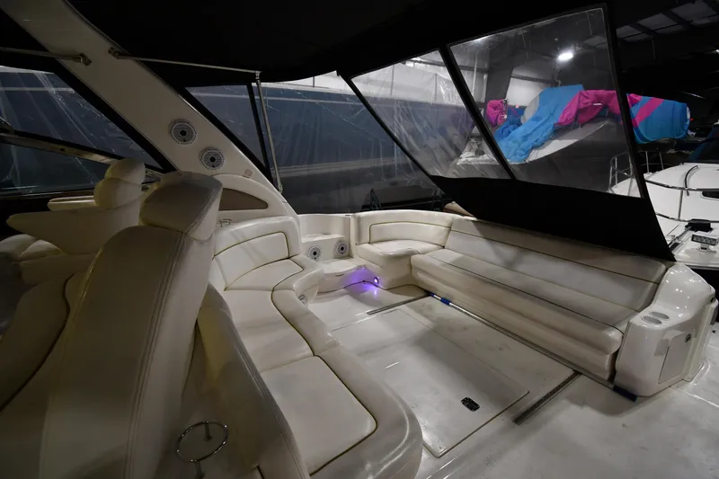 Slide: The Image of 2000 Sea Ray 460 Sundancer yacht interior with white leather seating and ambient lighting. - 13