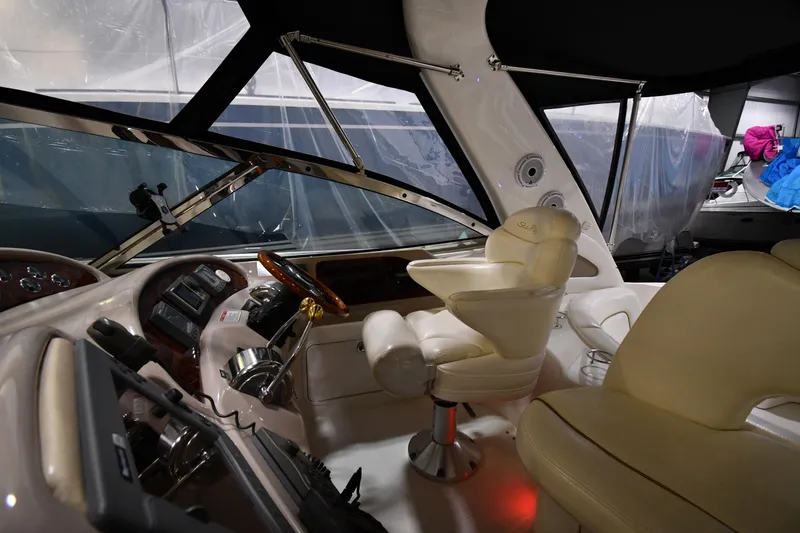 Slide: The Image of Interior of 2000 Sea Ray 460 Sundancer yacht with helm and seating area. - 18