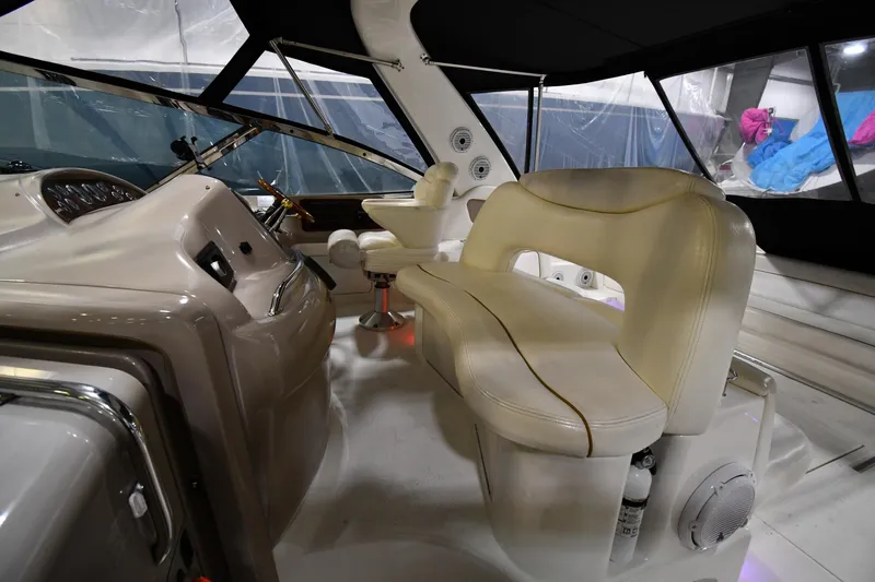 Slide: The Image of Interior of 2000 Sea Ray 460 Sundancer yacht with beige seating and helm station. - 20