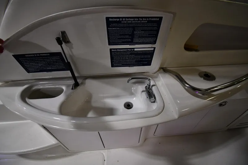 Slide: The Image of 2000 Sea Ray 460 Sundancer yacht sink and countertop area. - 22
