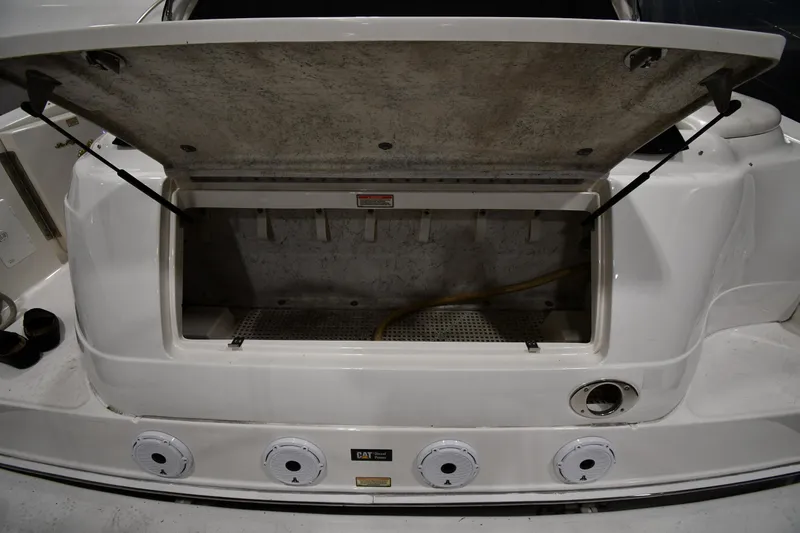 Slide: The Image of Open storage compartment on a 2000 Sea Ray 460 Sundancer boat. - 24