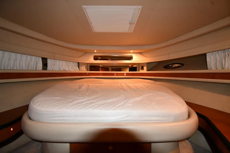 Slide: The Image of Interior cabin of 2000 Sea Ray 460 Sundancer yacht with bed and ambient lighting. - 27