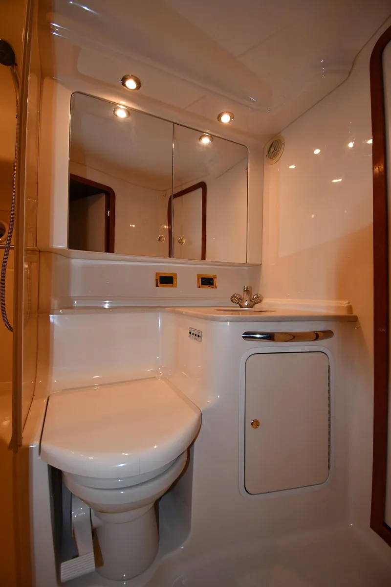 Slide: The Image of 2000 Sea Ray 460 Sundancer yacht bathroom with modern fixtures and lighting. - 35