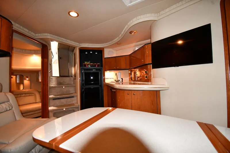 Slide: The Image of Interior of 2000 Sea Ray 460 Sundancer yacht with modern kitchen and seating area. - 40