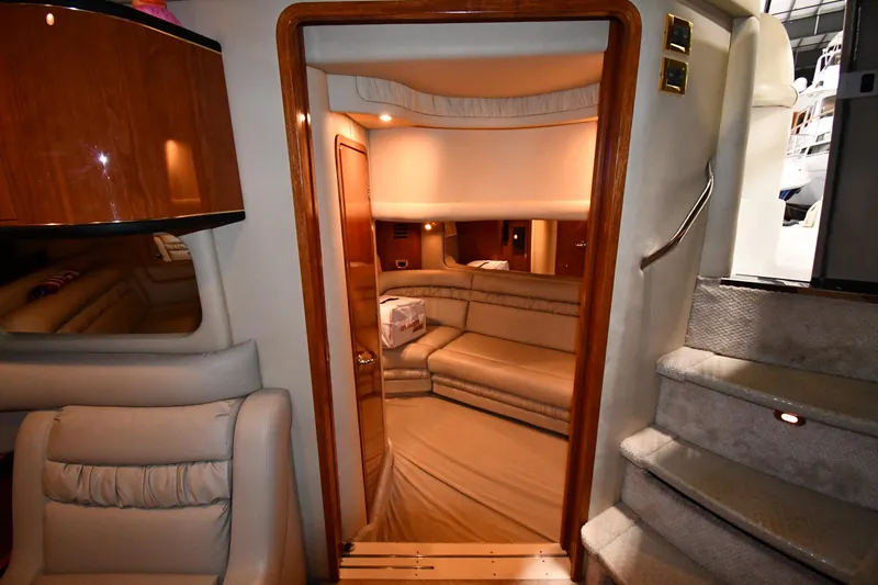 Slide: The Image of Interior of 2000 Sea Ray 460 Sundancer yacht, featuring luxurious seating and elegant design. - 49