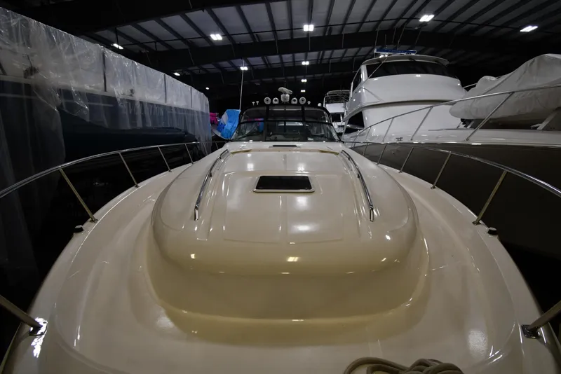 Slide: The Image of 2000 Sea Ray 460 Sundancer yacht in indoor storage, front view. - 5