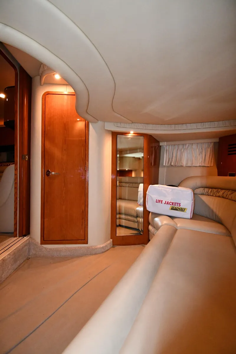 Slide: The Image of Interior of 2000 Sea Ray 460 Sundancer yacht with elegant wood finishes. - 51
