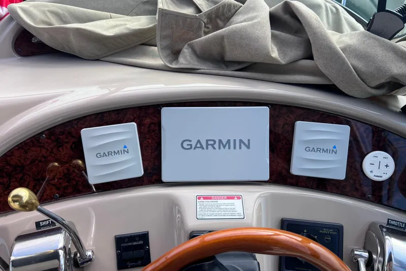 Slide: The Image of Garmin navigation system on 2000 Sea Ray 460 Sundancer boat dashboard. - 84