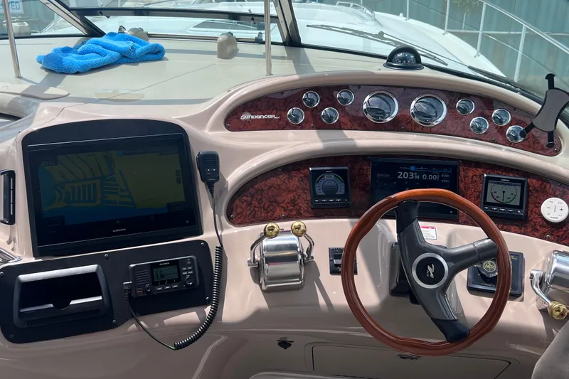 Slide: The Image of Cockpit of 2000 Sea Ray 460 Sundancer with navigation and control instruments. - 85