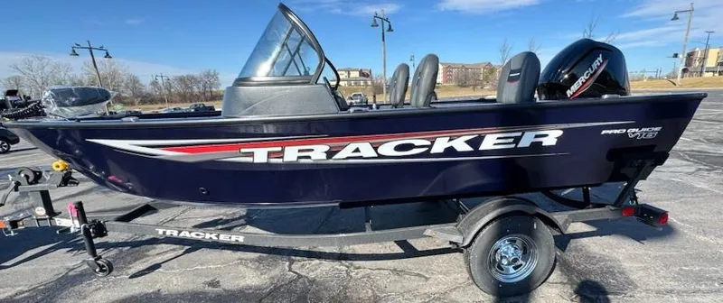 Slide: The Image of 2025 Tracker Pro Guide V-16 WT boat on trailer, parked outdoors. - 3