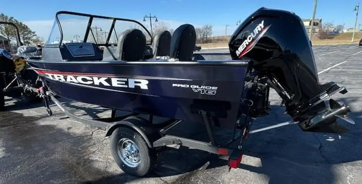 Slide: The Image of 2025 Tracker Pro Guide V-16 WT boat with Mercury engine on trailer. - 4