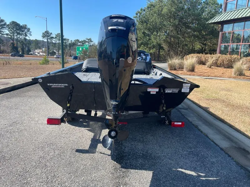 Slide: The Image of 2025 Tracker Pro Team 175 Crappie Edition boat, rear view, parked outdoors. - 2