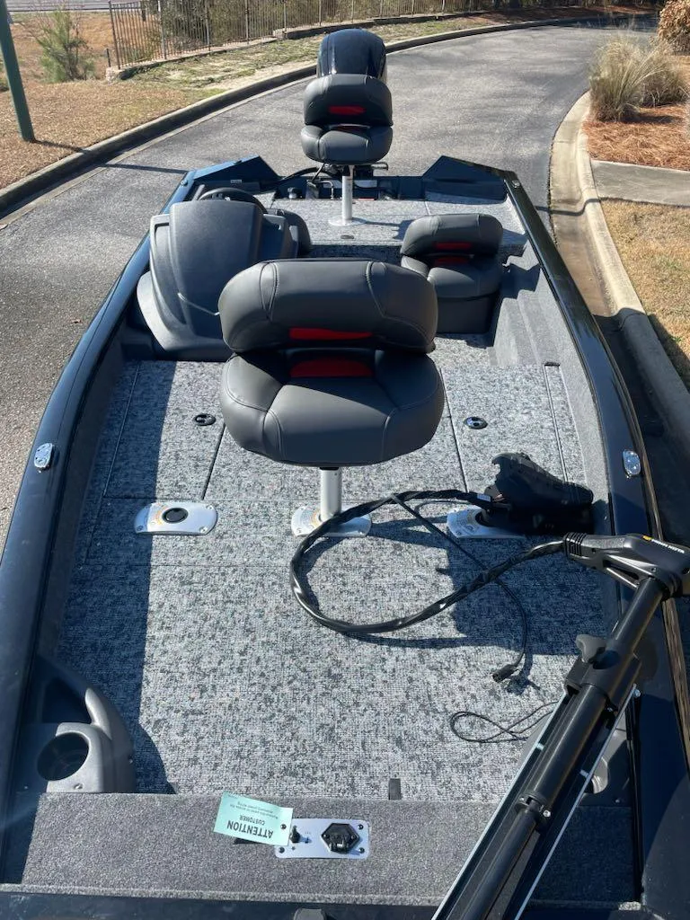 Slide: The Image of 2025 Tracker Pro Team 175 Crappie Edition boat with seating and fishing setup. - 4