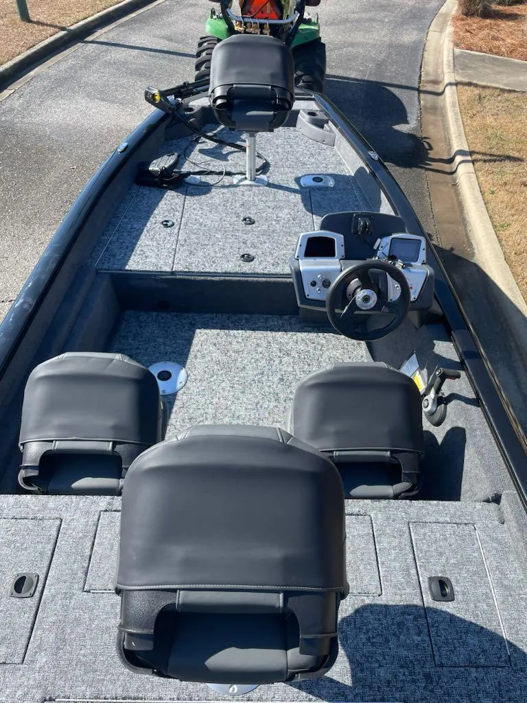 Slide: The Image of 2025 Tracker Pro Team 175 Crappie Edition boat interior with seating and control panel. - 5