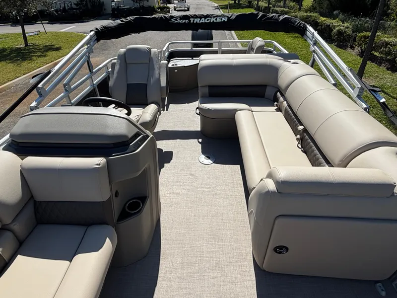 Slide: The Image of 2025 Sun Tracker Fishin' Barge 20 DLX with spacious seating and modern design. - 2