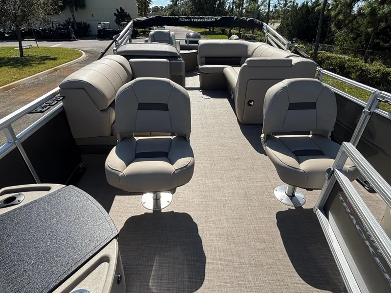 Slide: The Image of 2025 Sun Tracker Fishin' Barge 20 DLX interior with comfortable seating and spacious layout. - 3