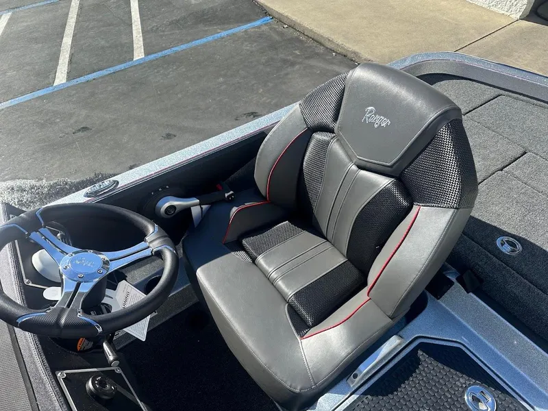 Slide: The Image of 2025 Ranger Z520 boat seat and steering wheel, featuring sleek design and premium materials. - 18