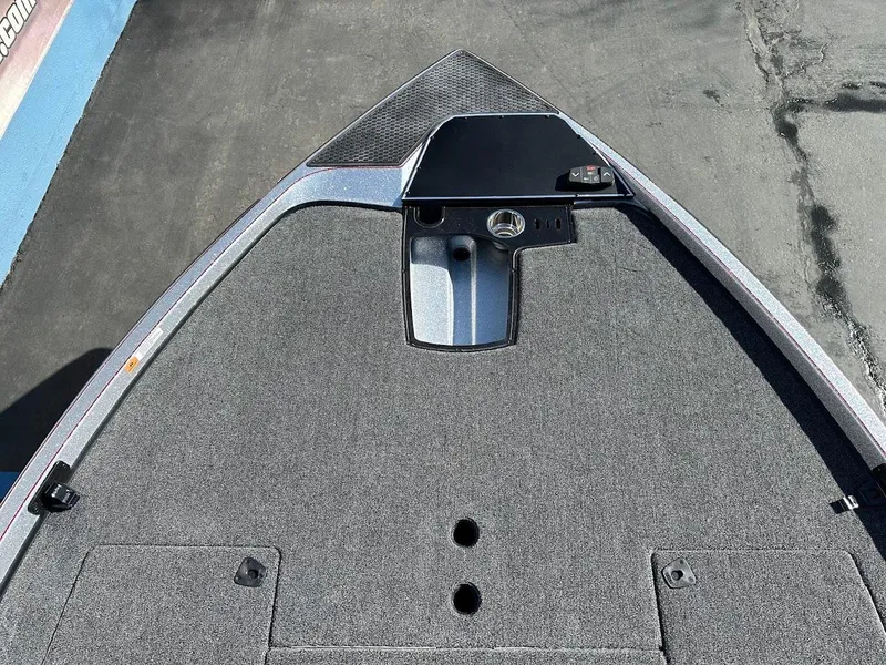 Slide: The Image of 2025 Ranger Z520 boat deck with carpeted surface and storage compartments. - 22