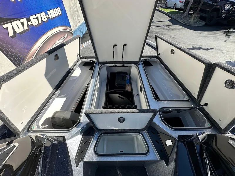 Slide: The Image of 2025 Ranger Z520 boat storage compartments open, showcasing spacious interior design. - 25