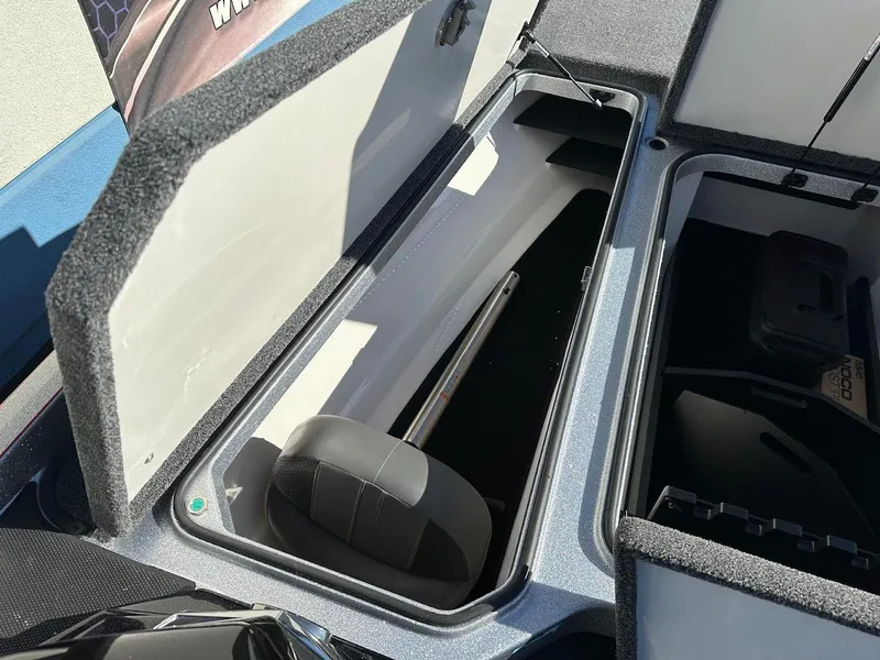 Slide: The Image of 2025 Ranger Z520 boat storage compartments open, showcasing interior space and design. - 26