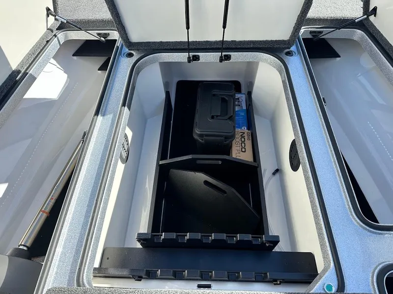 Slide: The Image of 2025 Ranger Z520 boat storage compartment with organized gear and equipment. - 27