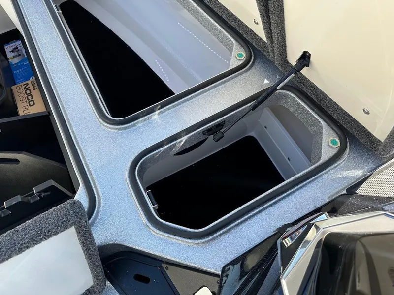 Slide: The Image of 2025 Ranger Z520 boat storage compartments with open lids, showcasing interior space. - 29