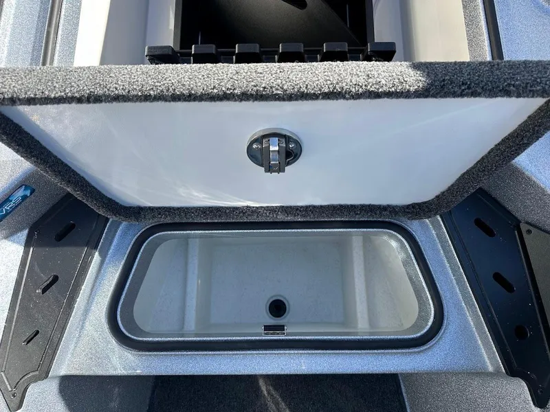 Slide: The Image of 2025 Ranger Z520 storage compartment with open lid, showcasing interior design. - 30