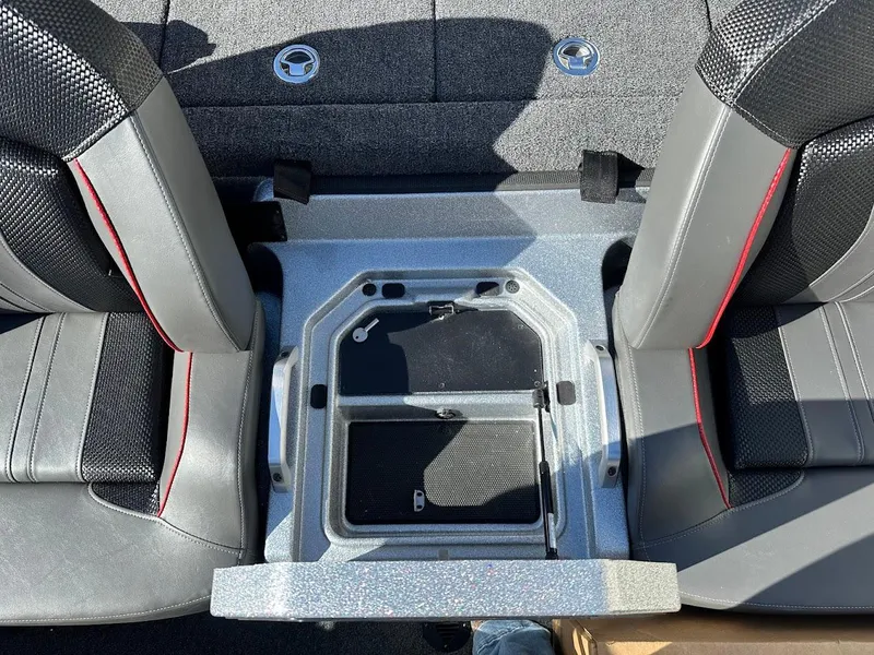 Slide: The Image of 2025 Ranger Z520 boat interior with seating and storage compartment. - 31