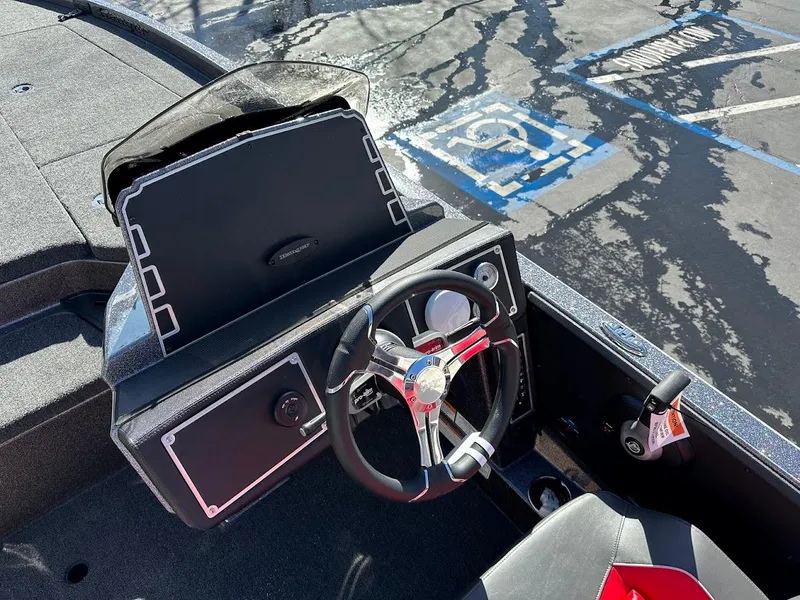 Slide: The Image of Open storage compartment in 2025 Ranger Z521 boat, showcasing interior space. - 19
