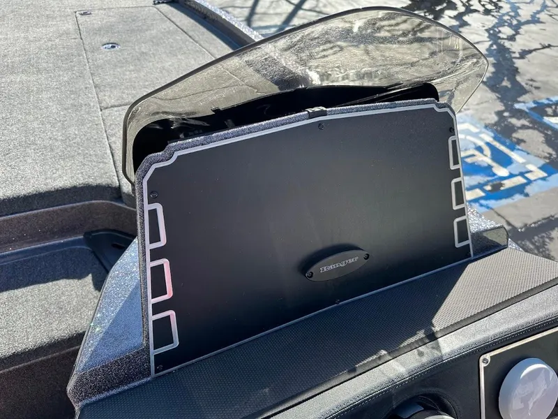Slide: The Image of Open storage compartment in 2025 Ranger Z521 boat. - 21