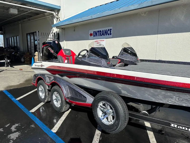 Slide: The Image of 2025 Ranger Z521 boat with V8 engine in a parking lot. - 6