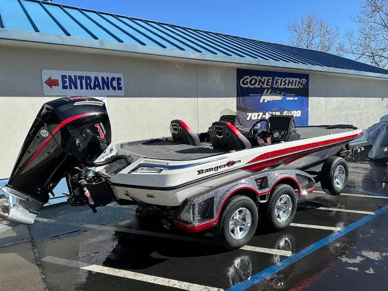 Slide: The Image of 2025 Ranger Z521 boat with Minn Kota and Humminbird equipment on a trailer. - 8