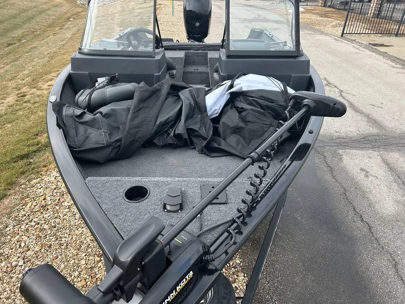 Slide: The Image of 2025 Tracker Pro Guide V-175 Combo boat with equipment on deck. - 10