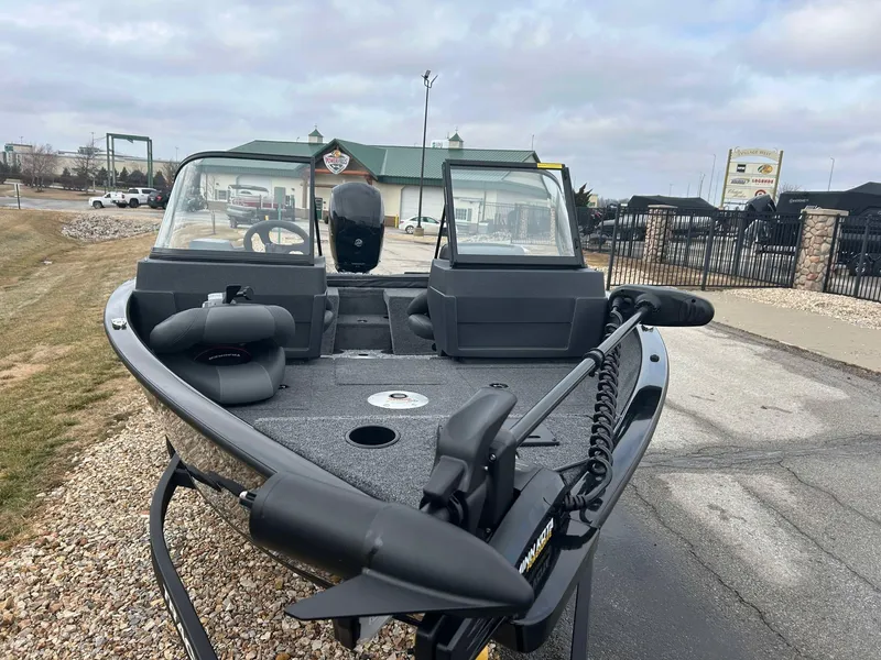 Slide: The Image of 2025 Tracker Pro Guide V-175 Combo boat on display outdoors, featuring a sleek design. - 6