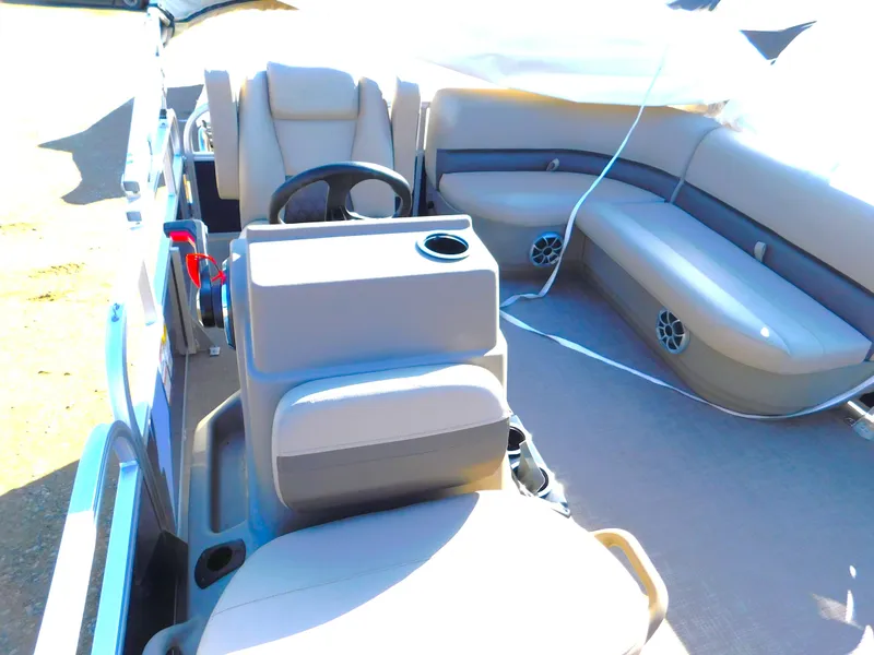 Slide: The Image of Interior of 2025 Sun Tracker Bass Buggy 16 XL Select pontoon boat with seating and steering console. - 13
