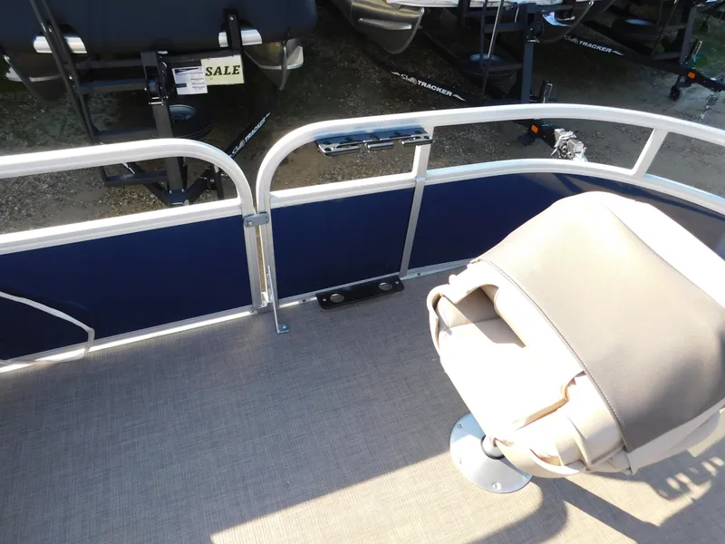 Slide: The Image of 2025 Sun Tracker Bass Buggy 16 XL Select boat interior with seating and railing. - 14
