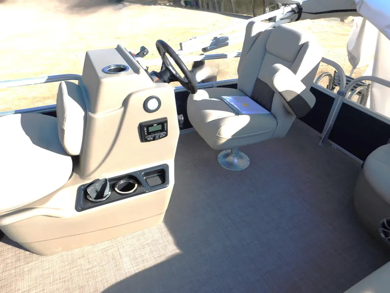Slide: The Image of 2025 Sun Tracker Bass Buggy 16 XL Select interior with steering console and seating. - 9