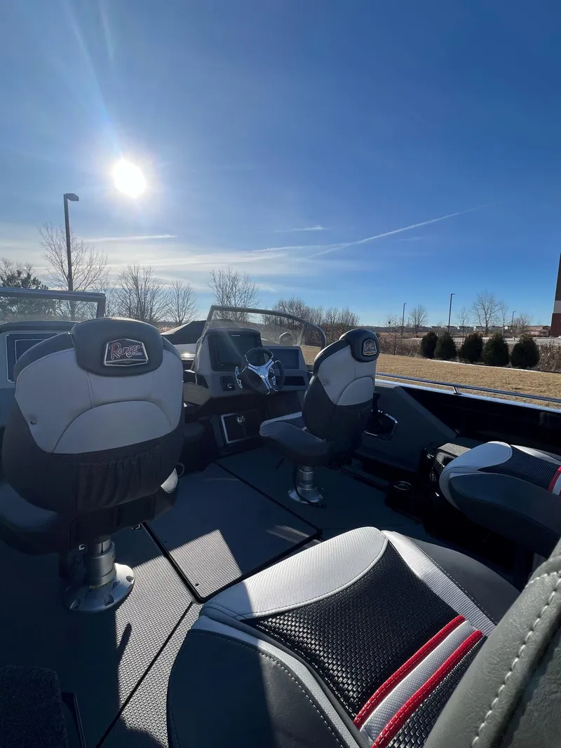 Slide: The Image of 2024 Ranger 622FS Pro boat interior with modern seating under a clear blue sky. - 12