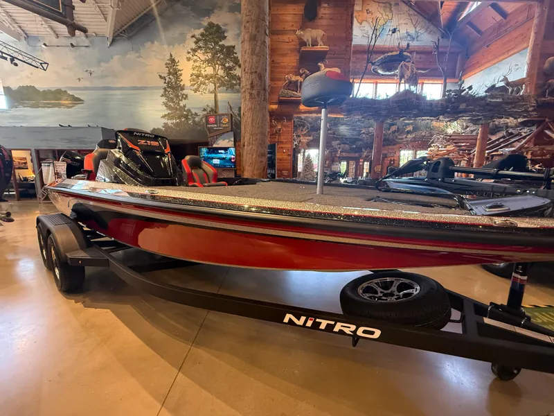 The Image of 2025 Nitro Z19 boat displayed indoors with scenic mural background. - 0