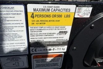 Slide: The Image of U.S. Coast Guard capacity label on 2025 Nitro Z19 boat, 4 persons or 500 lbs. - 3