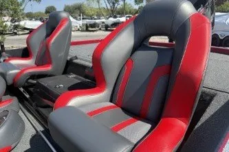 Slide: The Image of 2025 Nitro Z19 boat seats with red and gray upholstery in a sunny outdoor setting. - 4